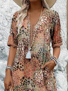 Womens summer dress featuring a V-neck design and vibrant floral pattern, knee-high length, comfortable fit, and plus sizes available for a stylish and flattering 5
