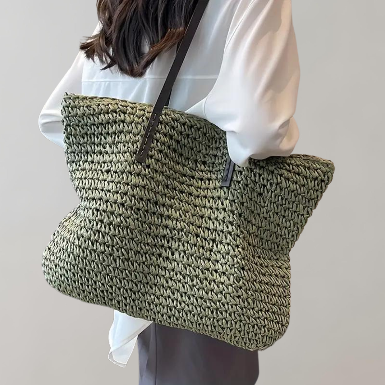 Woven tote bag with leather handles, perfect lightweight beach bag for summer adventures, showcasing a stylish design and spacious interior. 0