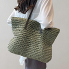 Woven tote bag with leather handles, perfect lightweight beach bag for summer adventures, showcasing a stylish design and spacious interior. 0