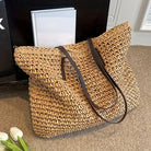 Woven tote bag with leather handles, perfect lightweight beach bag for summer adventures, showcasing a stylish design and spacious interior. 2