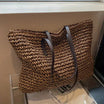 Woven tote bag with leather handles, perfect lightweight beach bag for summer adventures, showcasing a stylish design and spacious interior. 3