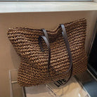 Woven tote bag with leather handles, perfect lightweight beach bag for summer adventures, showcasing a stylish design and spacious interior. 3