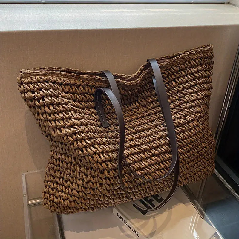 Woven tote bag with leather handles, perfect lightweight beach bag for summer adventures, showcasing a stylish design and spacious interior. 3
